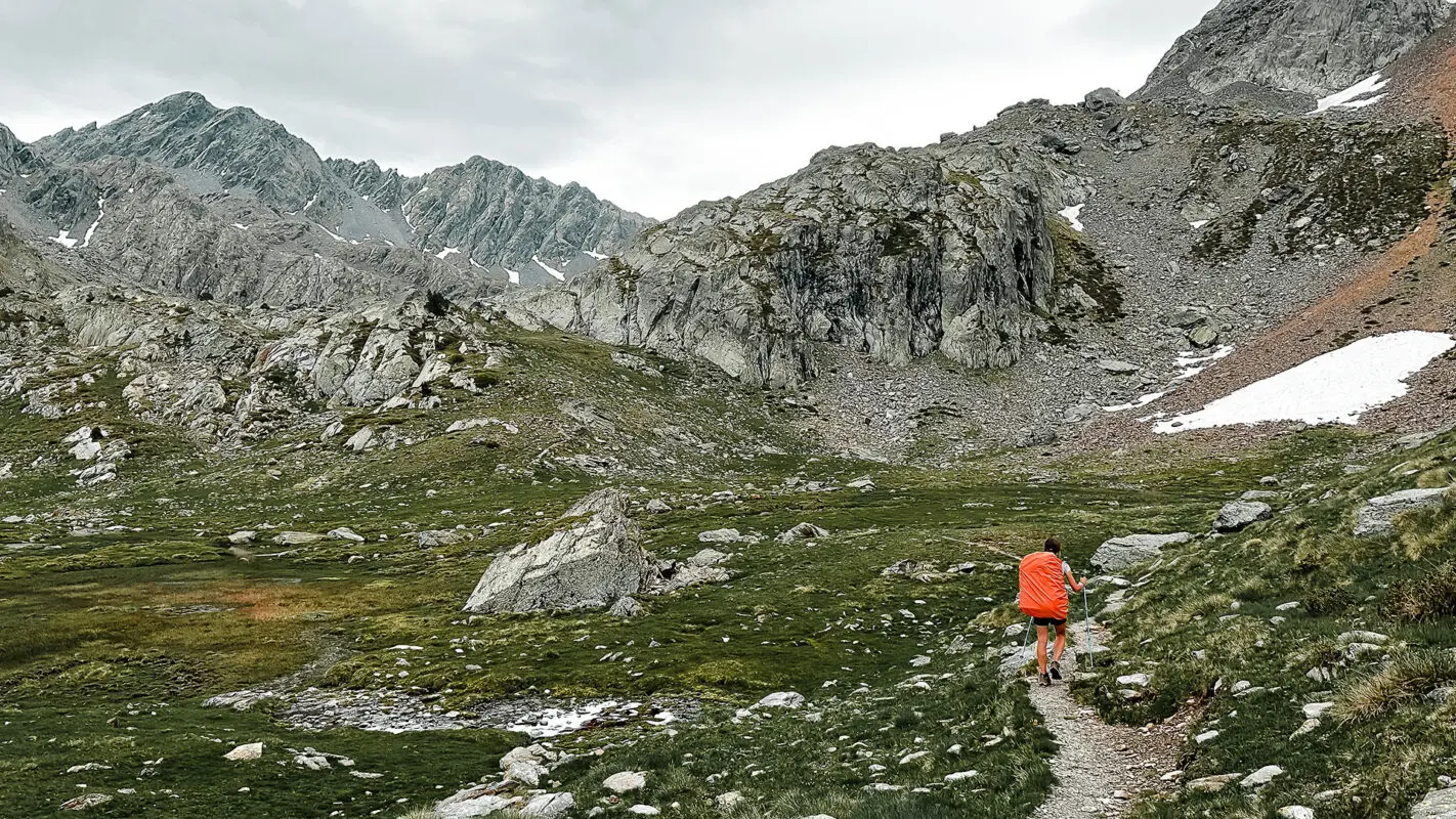 Women hiking on mountain trail in the Pyrenees on GR11