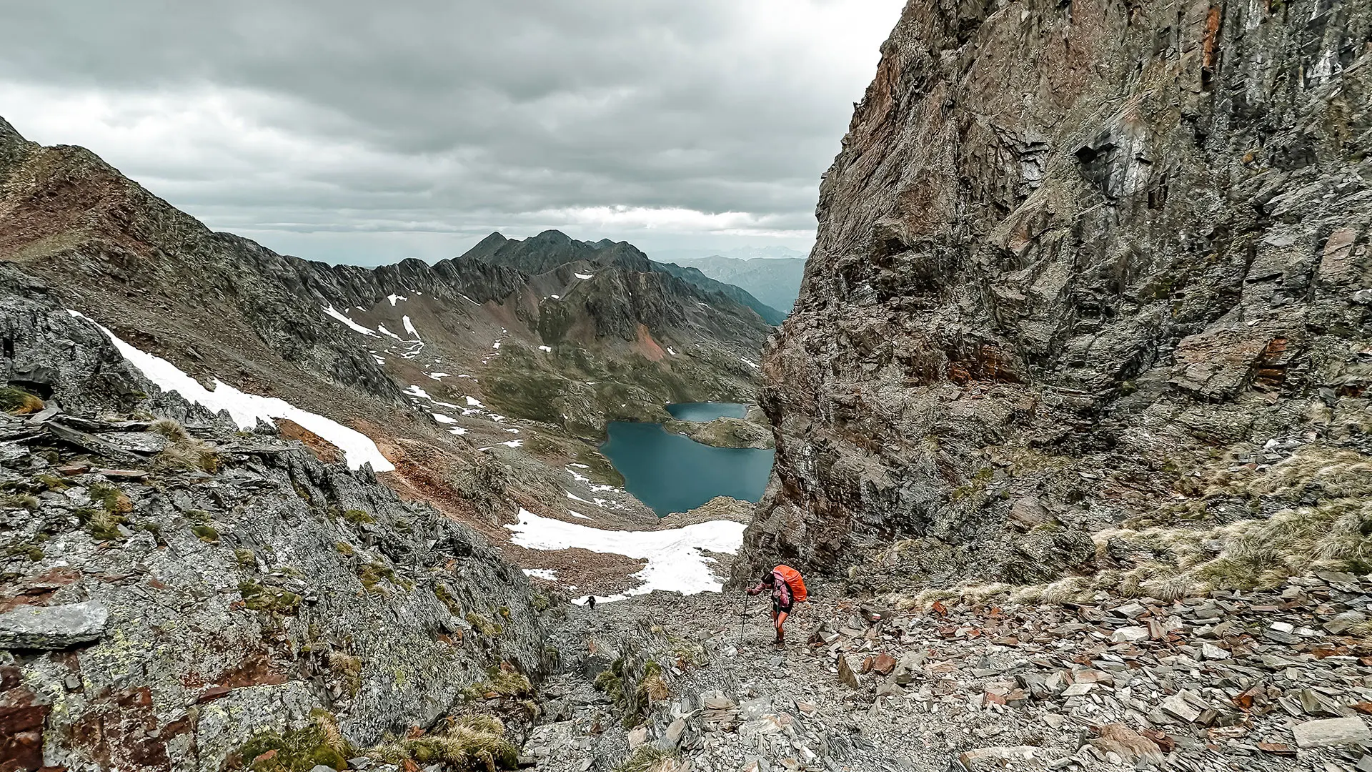 Women hiking in Pyrenees mountains. Stormy weather