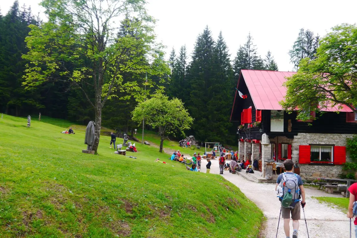 Hikers arriving at mountain hut at the end of the day, Dolomites Italy