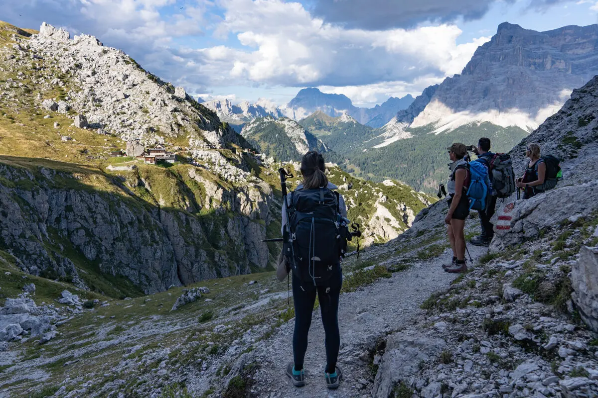 Group of hikers looking out on mountain landscape in the Dolomites