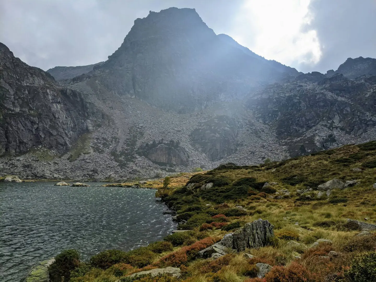 A mountain with a body of water in the foreground in Pyrénées-Orientales, France