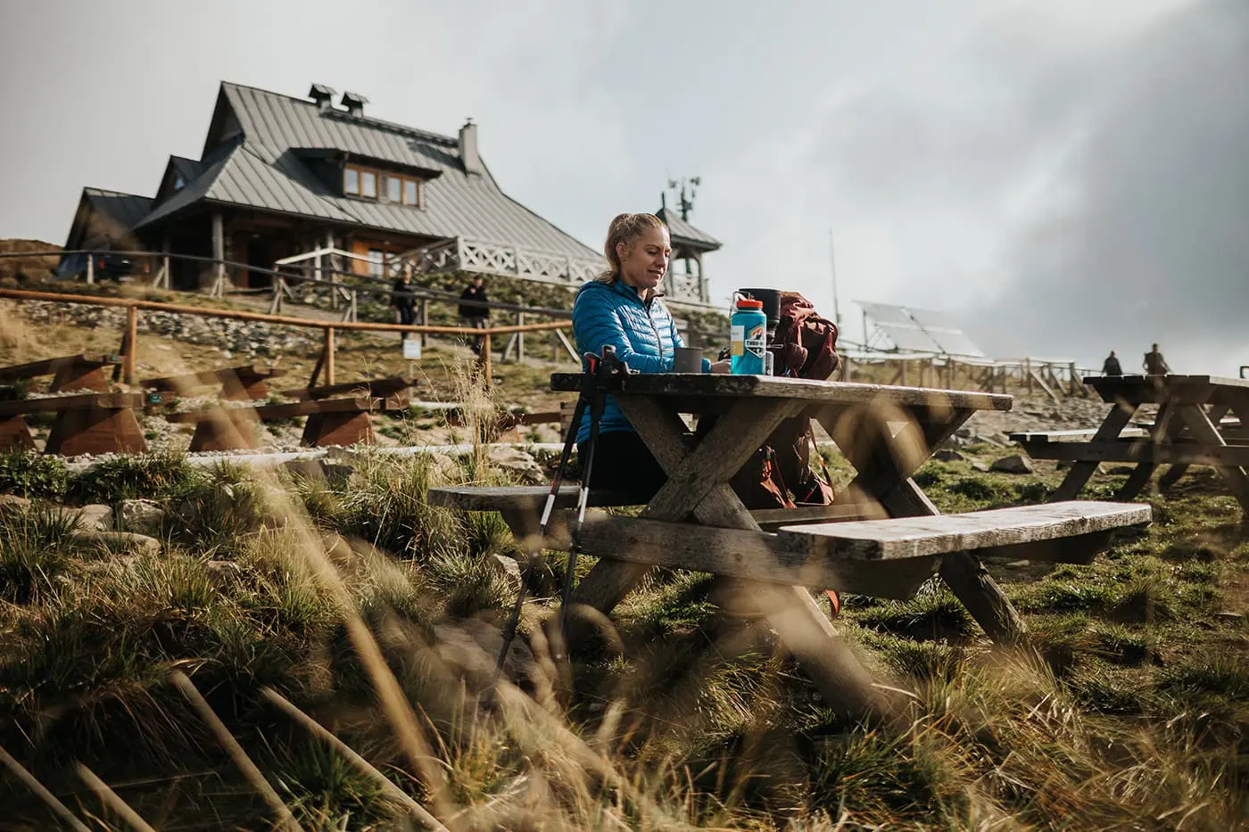 women sitting outside on picnic table