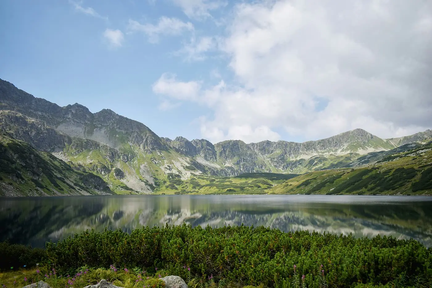 body of water surrounded by mountains