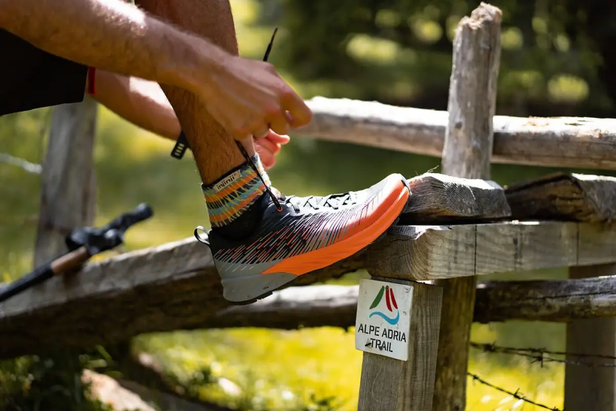 person tying his shoe