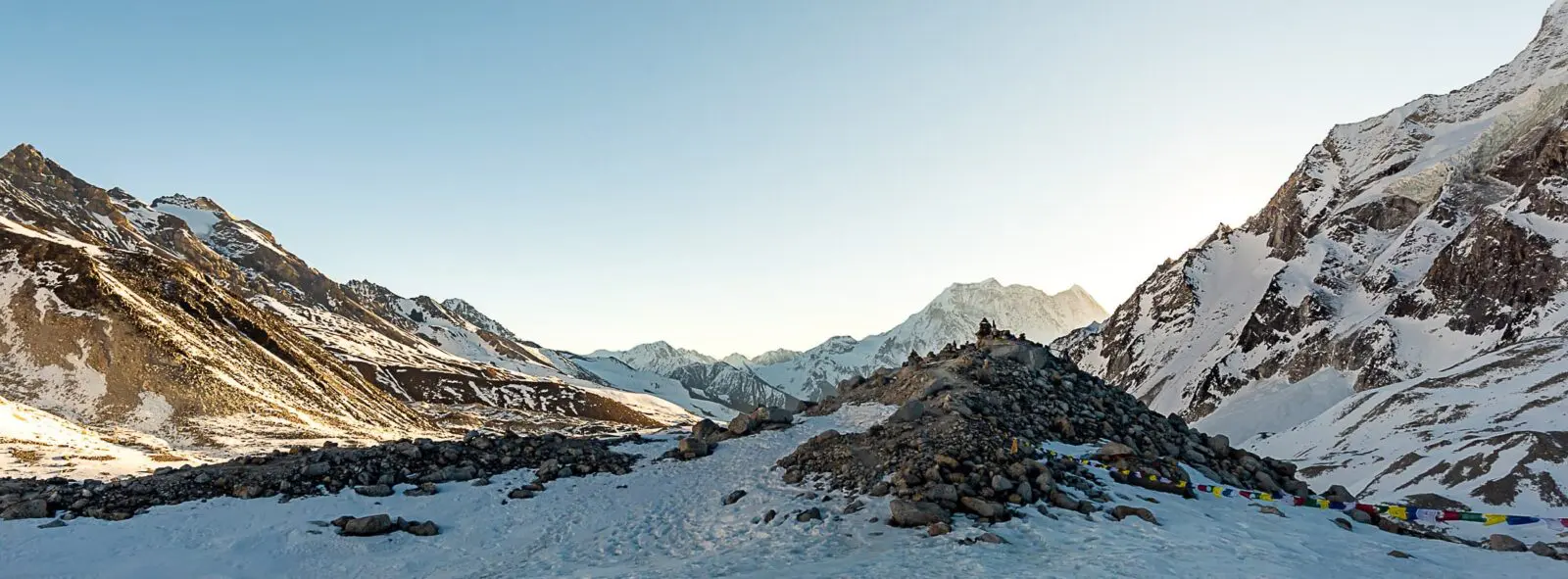 panoramic view of snow covered mountain valley