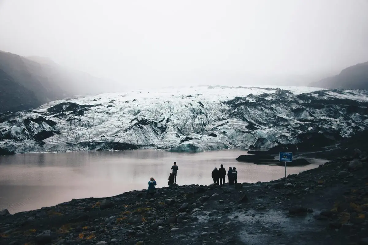 glacier near body of water