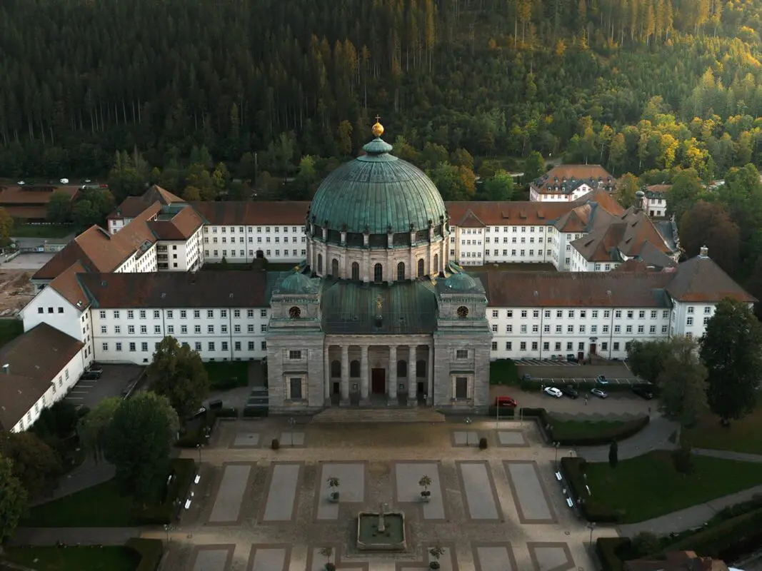 old big monastery surrounded by forest