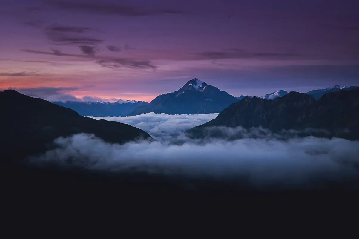 panoramic view of mountains in the alps during sunset