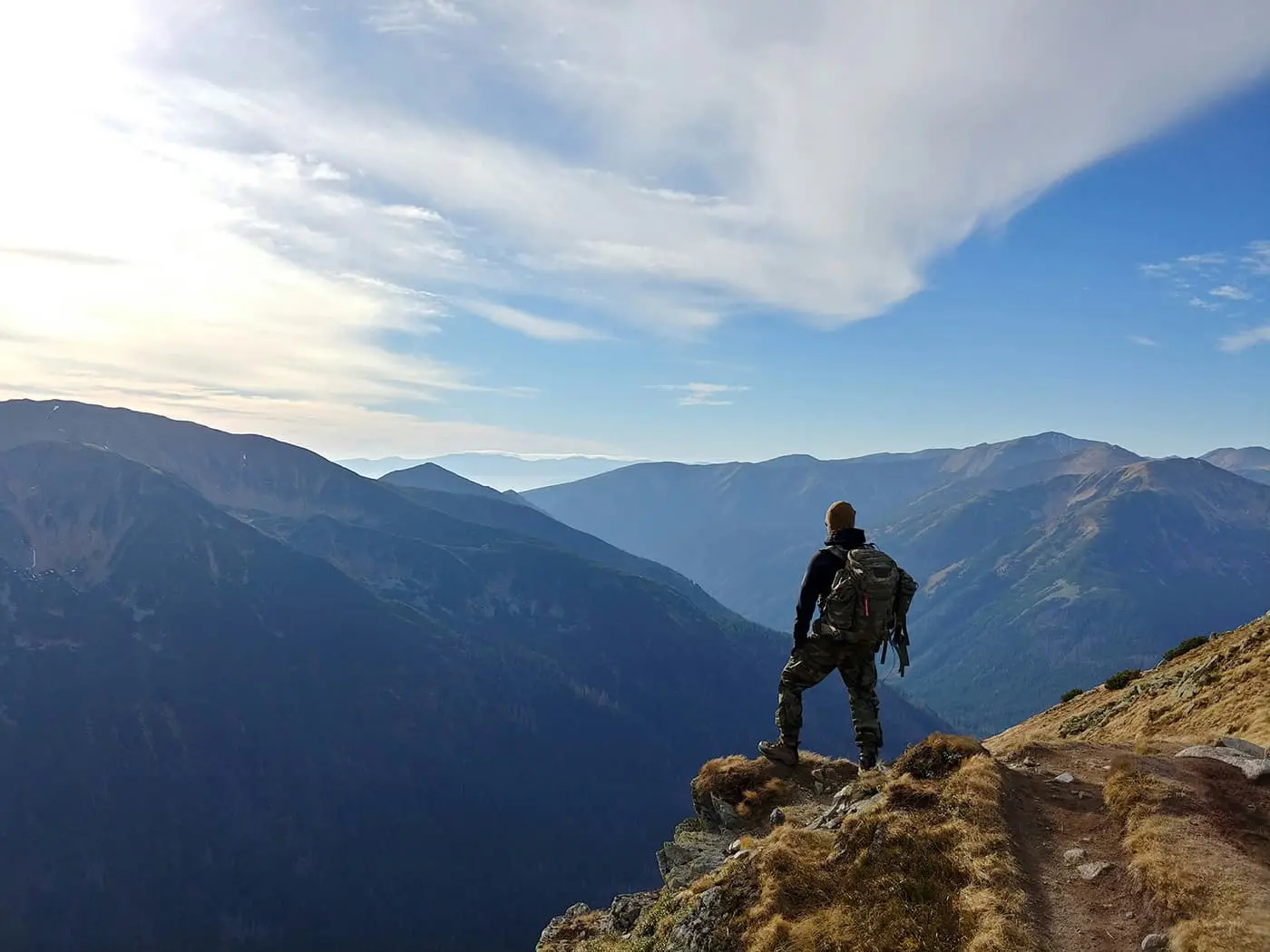 man looking out over mountains