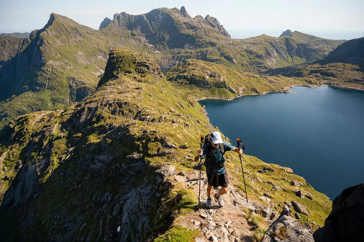 man hiking up a mountain