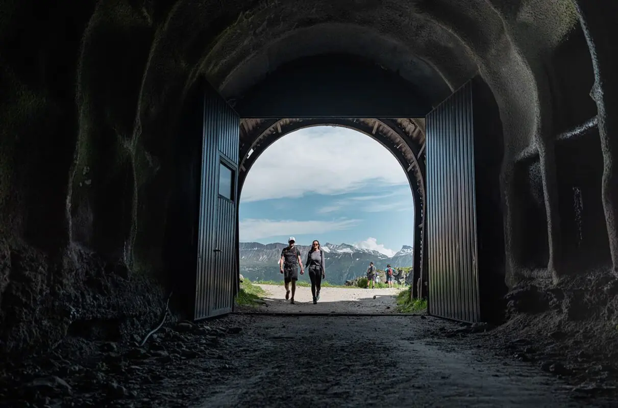 couple walking towards tunnel