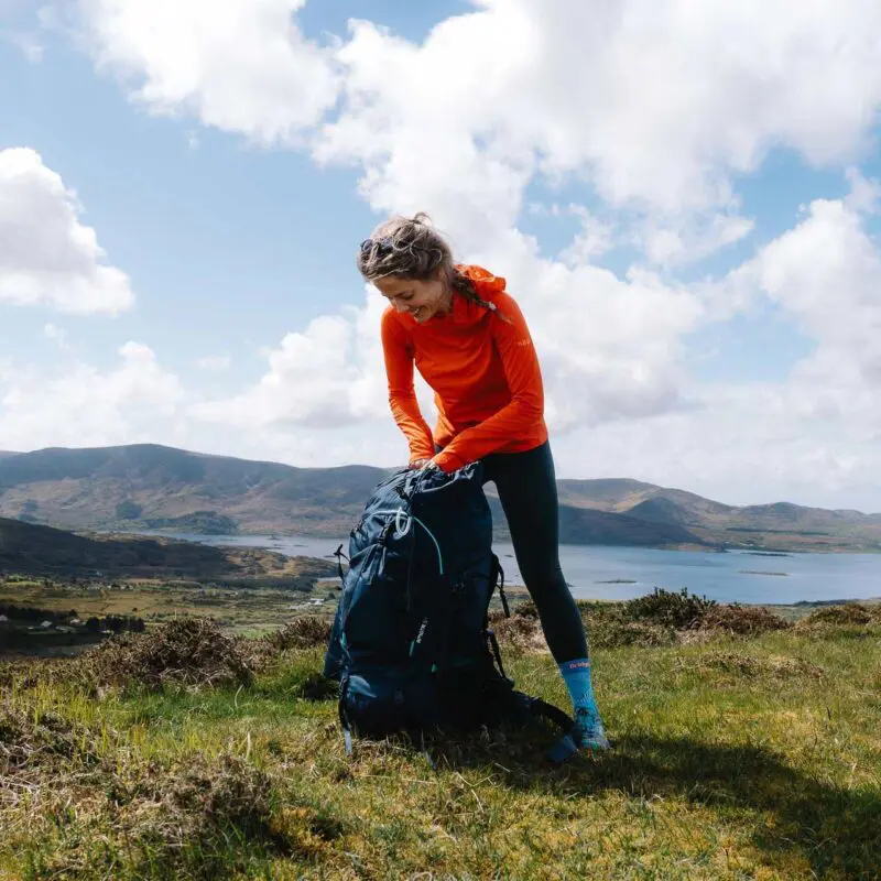 women packing her backpack