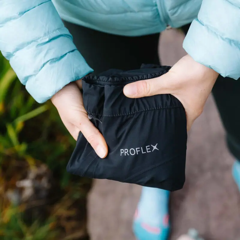 women holding folded pants