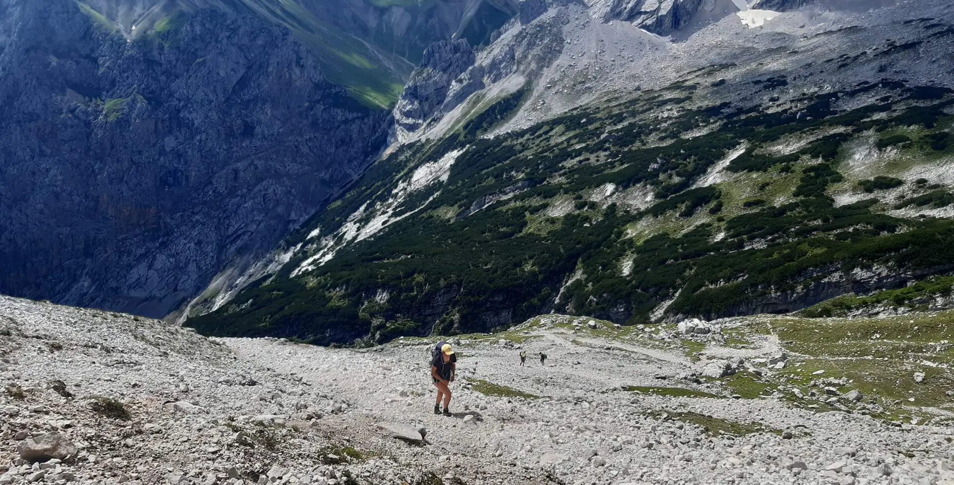 women hiking up mountain path