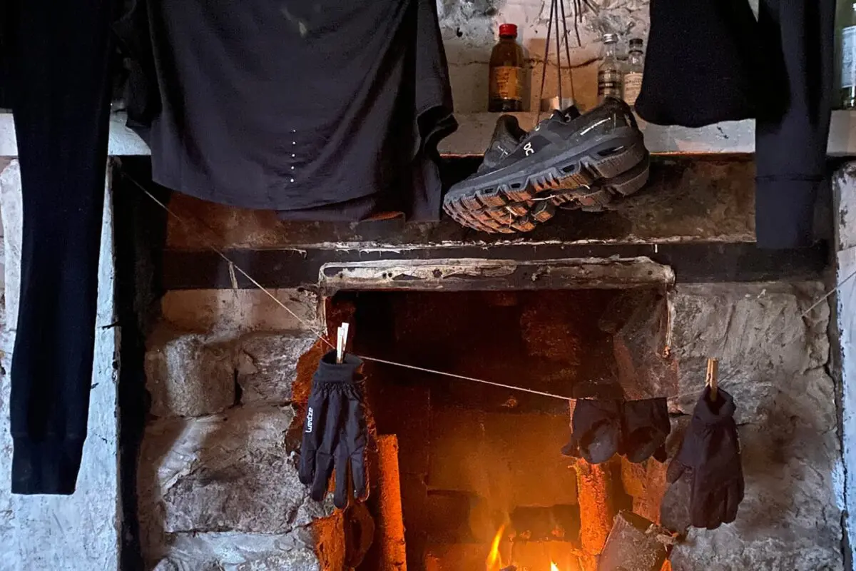 clothing and shoes drying by the fire