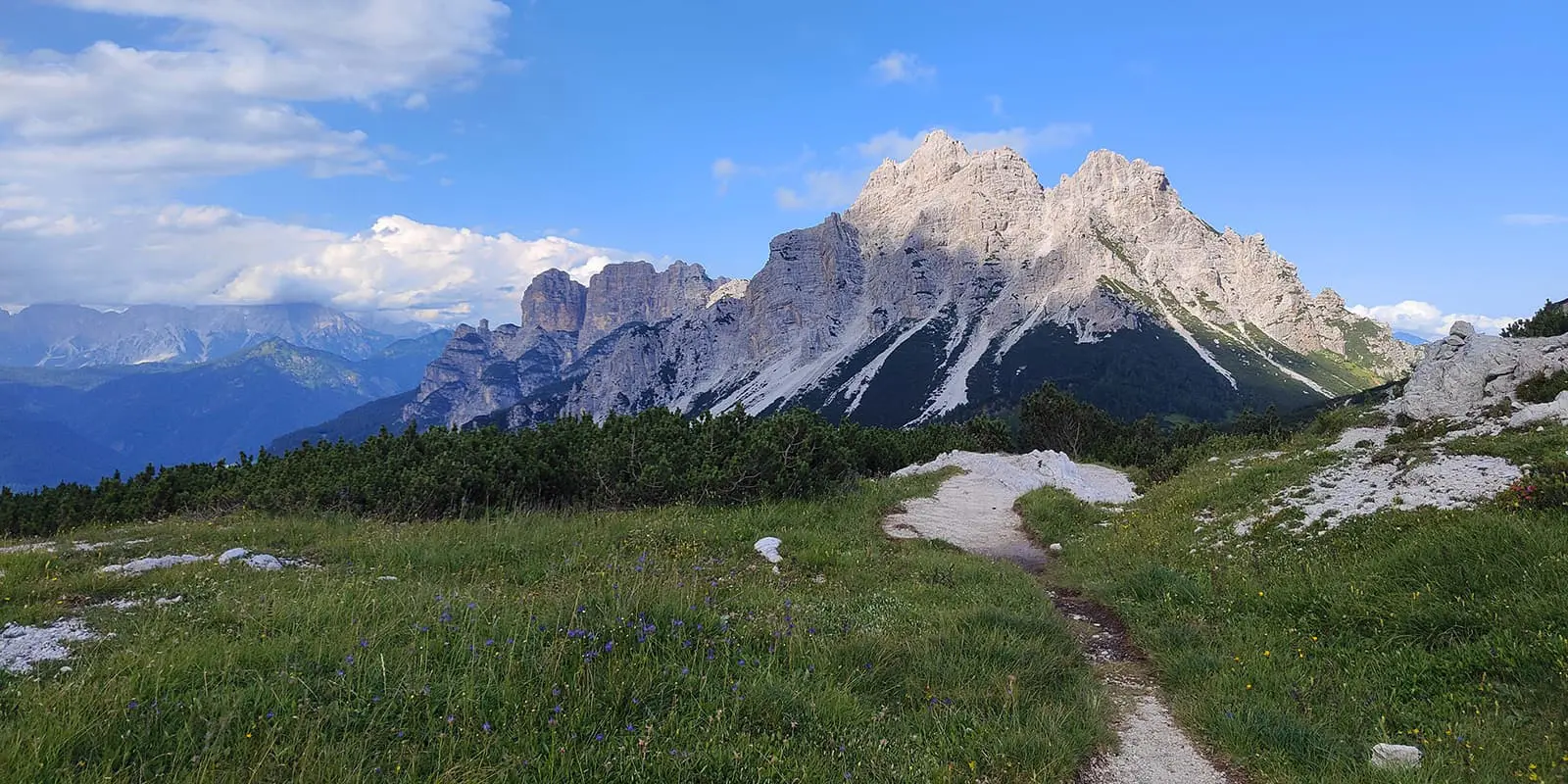 small mountain path leading up to mountain peak in the Dolomites