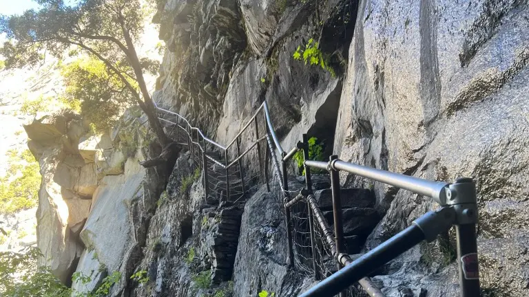 small mountain trail with fence