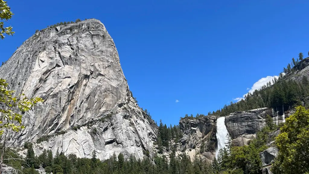 big rock formation and waterfall in Yosemite Valley