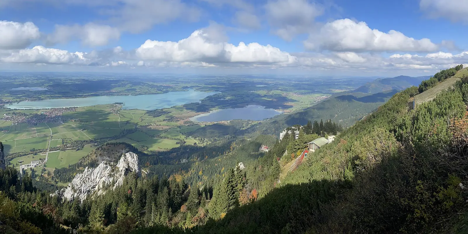 panoramic view atop of mountain of green landscape with lakes