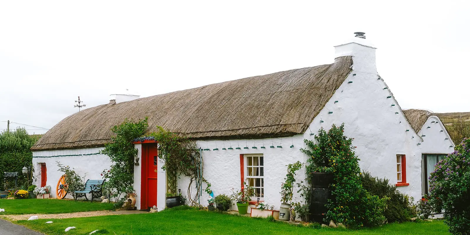 a small white house in Irish countryside