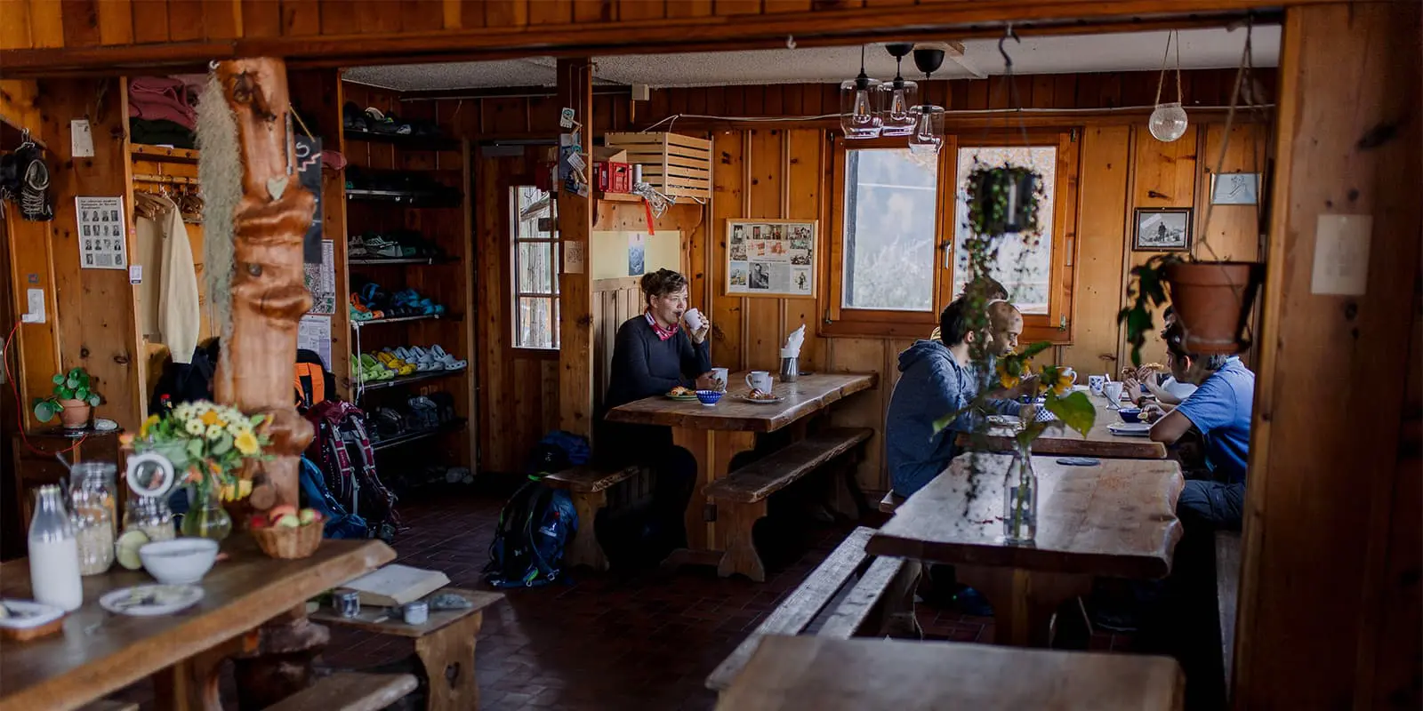 women drinking coffee in mountain hut