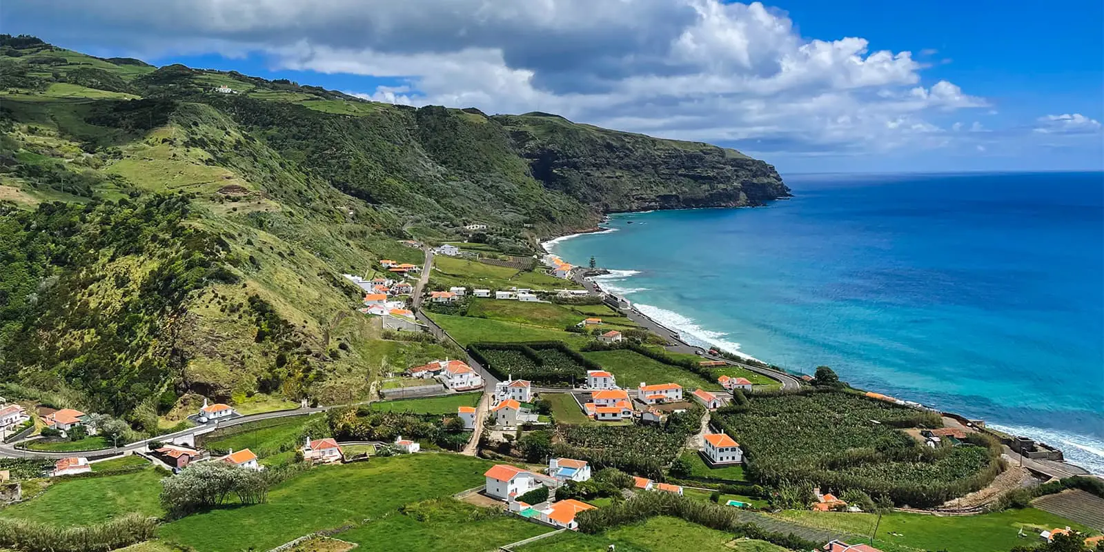 green coastline near blue ocean on the grand route santa maria