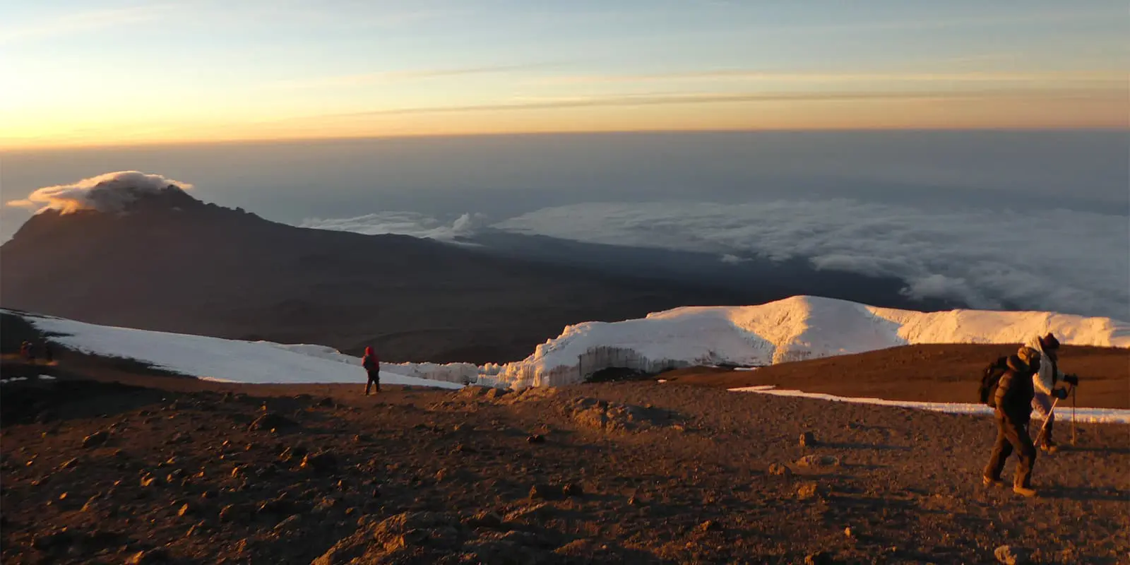 hikers climbing mount Kilimanjaro