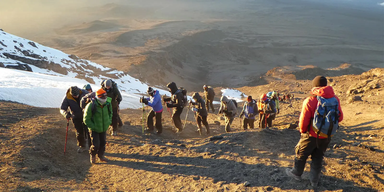 hikers summiting Kilimanjaro