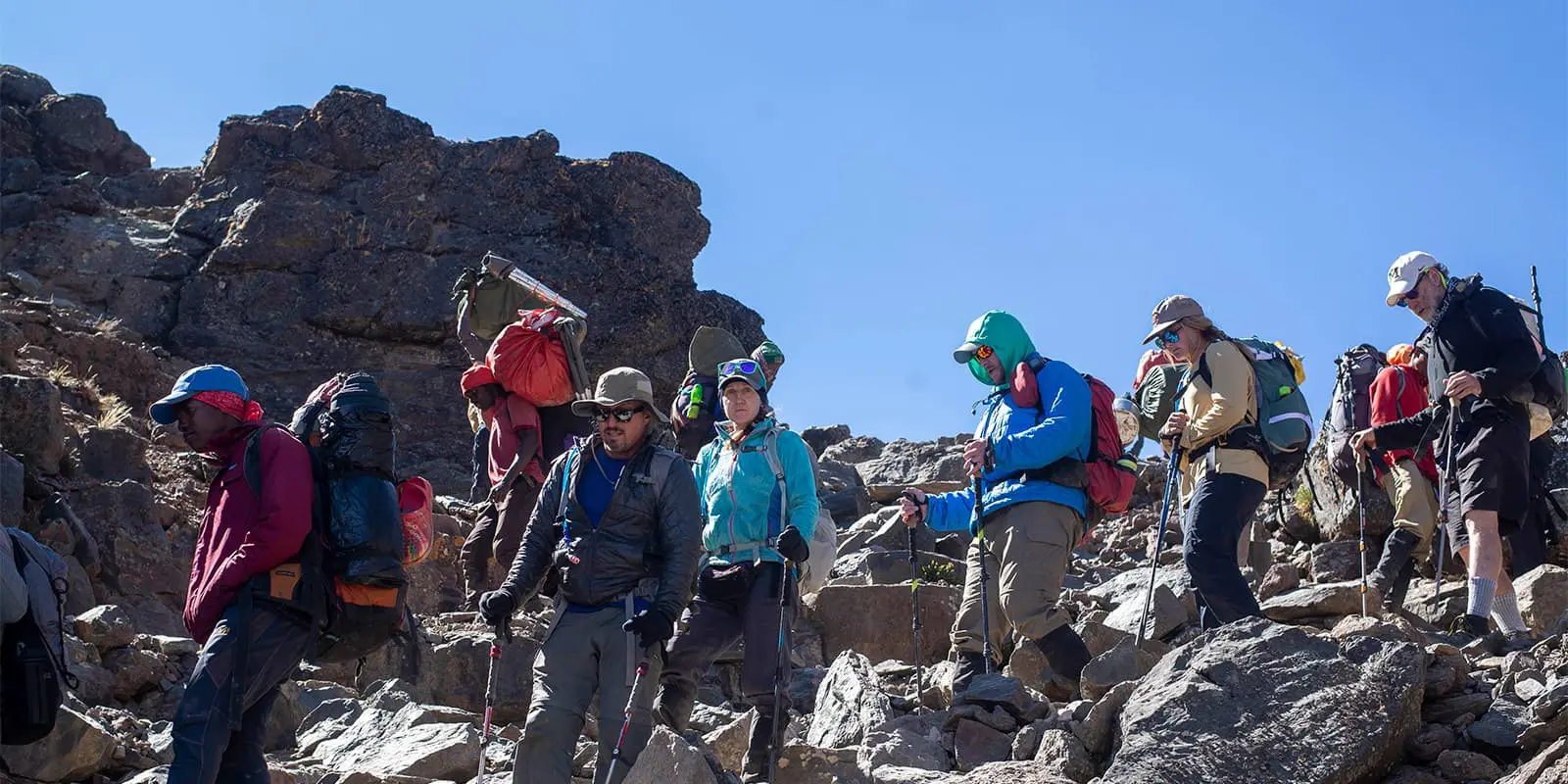 hikers summiting Kilimanjaro