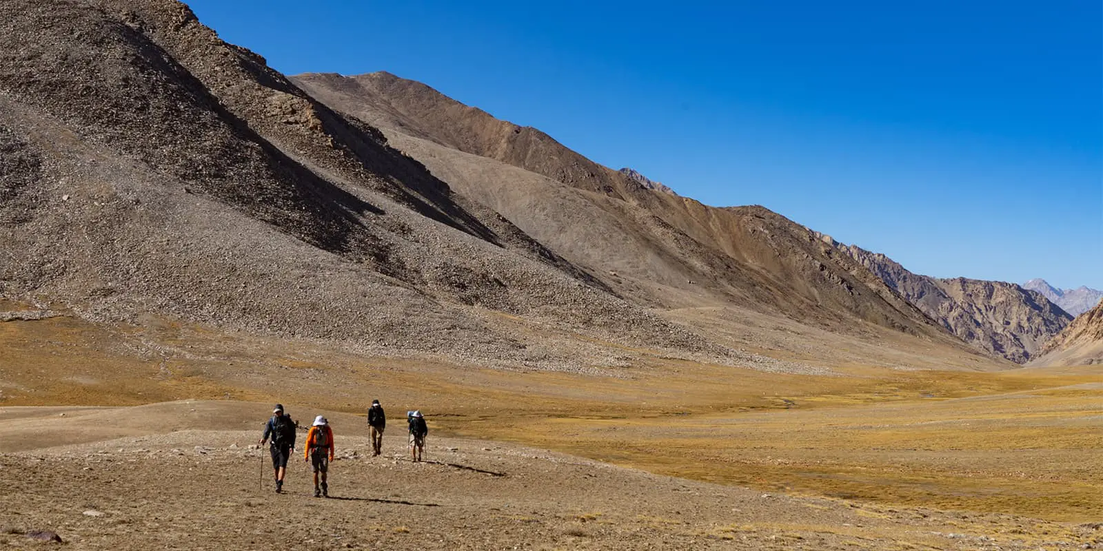 group of people hiking on the Pamir Trail in Tajikistan