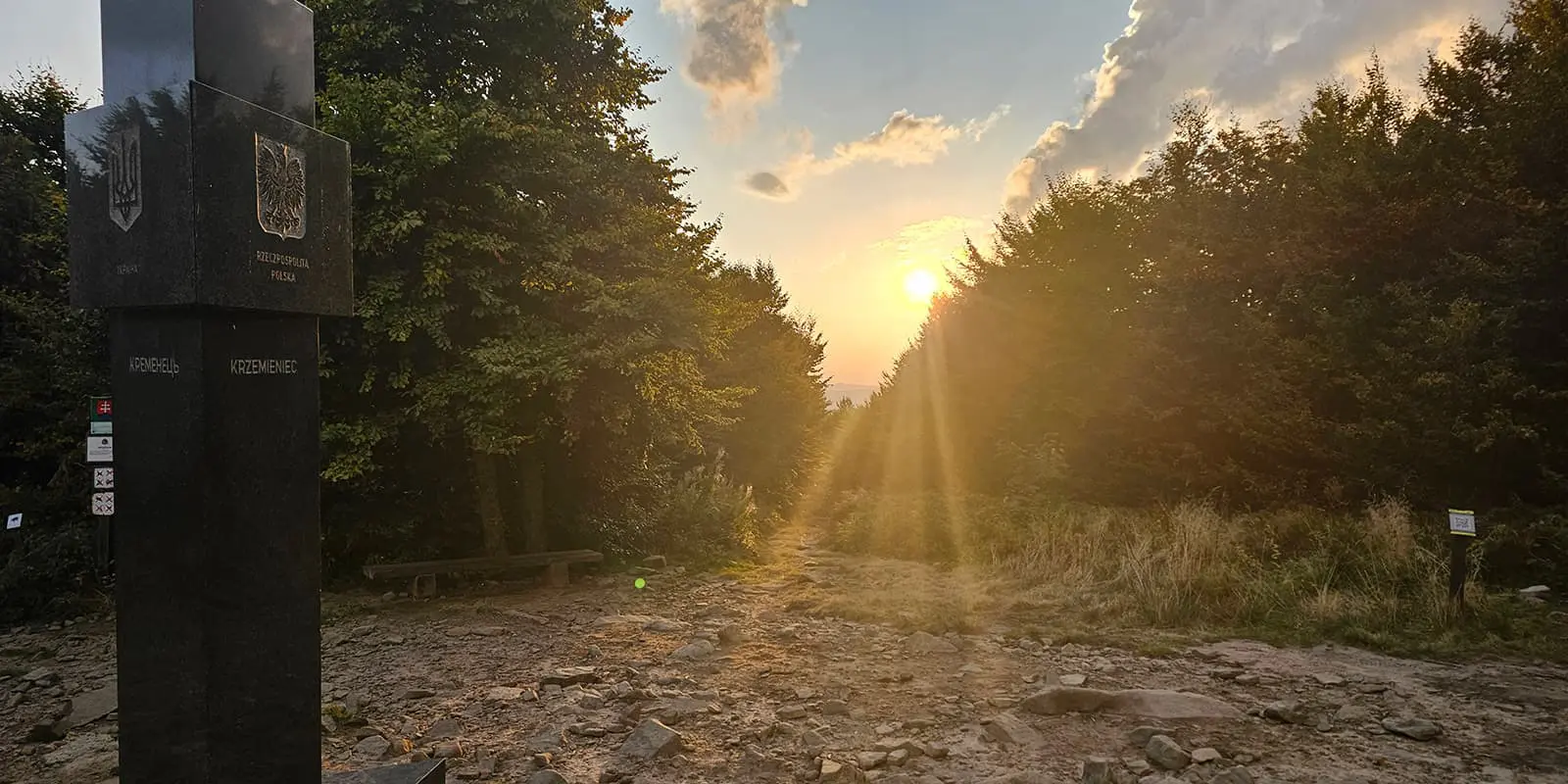 sunset by landmark in forest in Poland