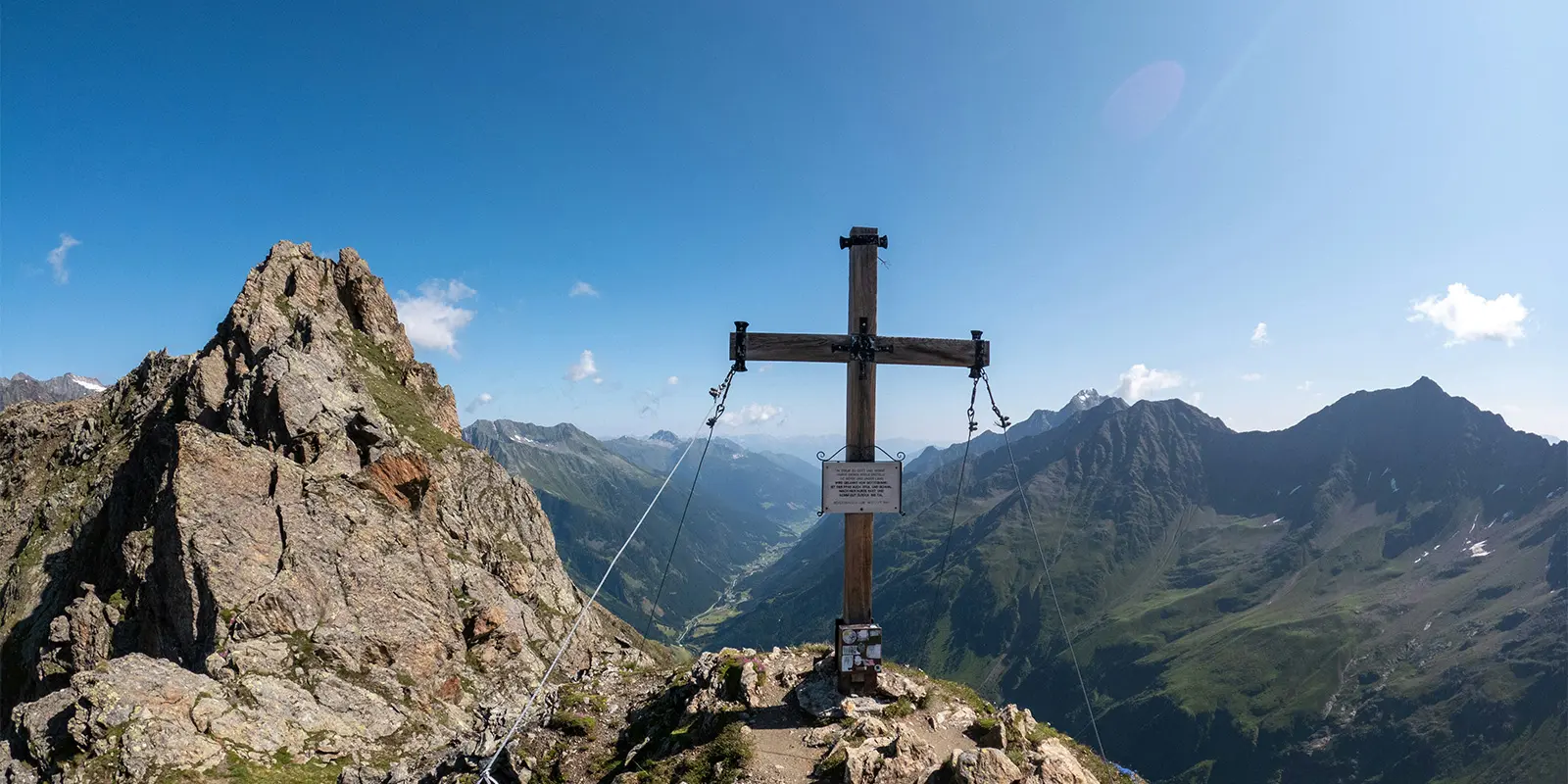 wooden cross on top of mountain in Austria
