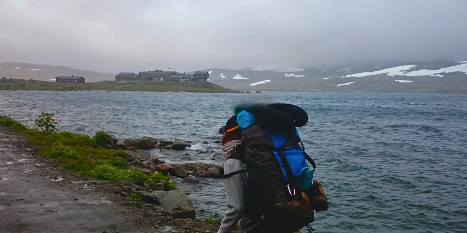 women hiking next to lake in Norway