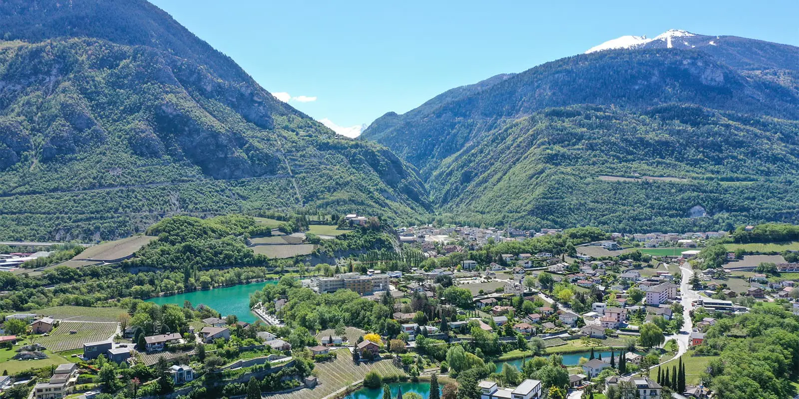 city of Sierre in Switzerland surrounded by green mountains