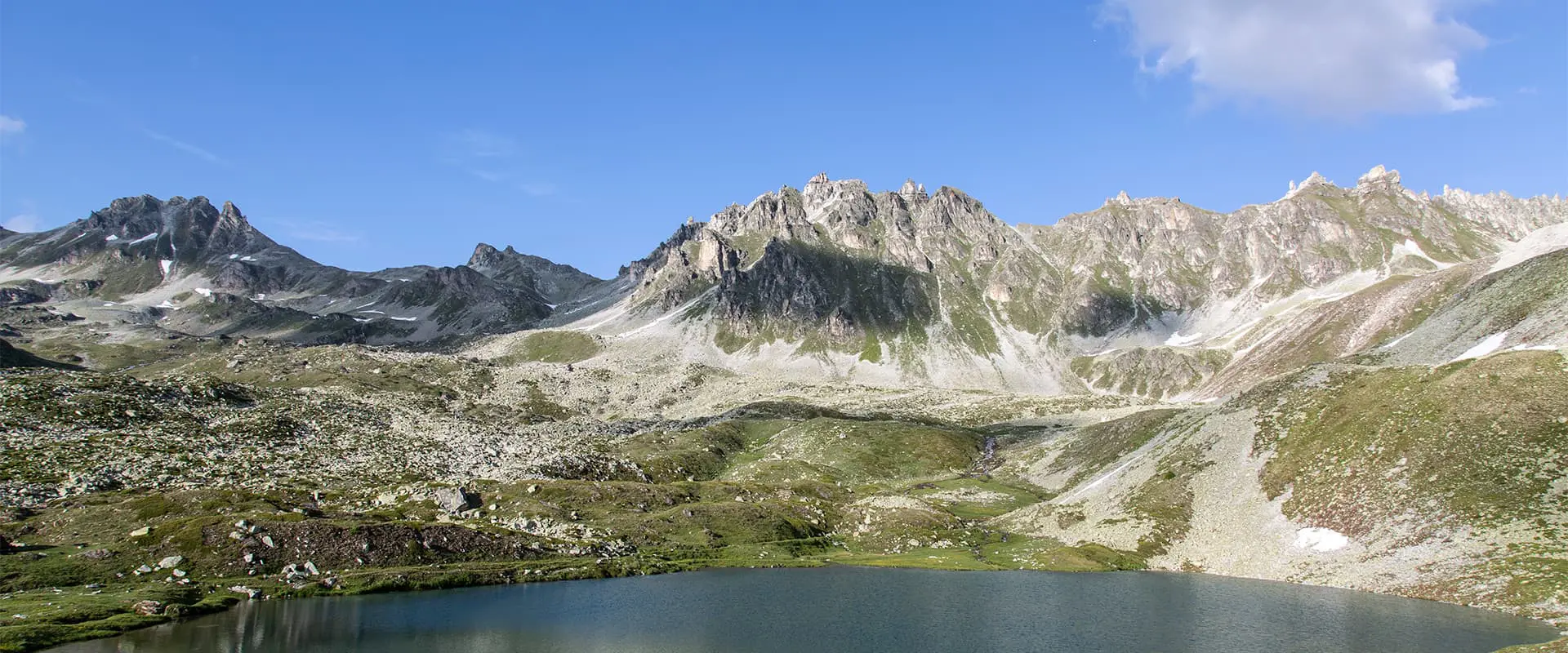 mountain lake in Switzerland towards the Bella Tola top