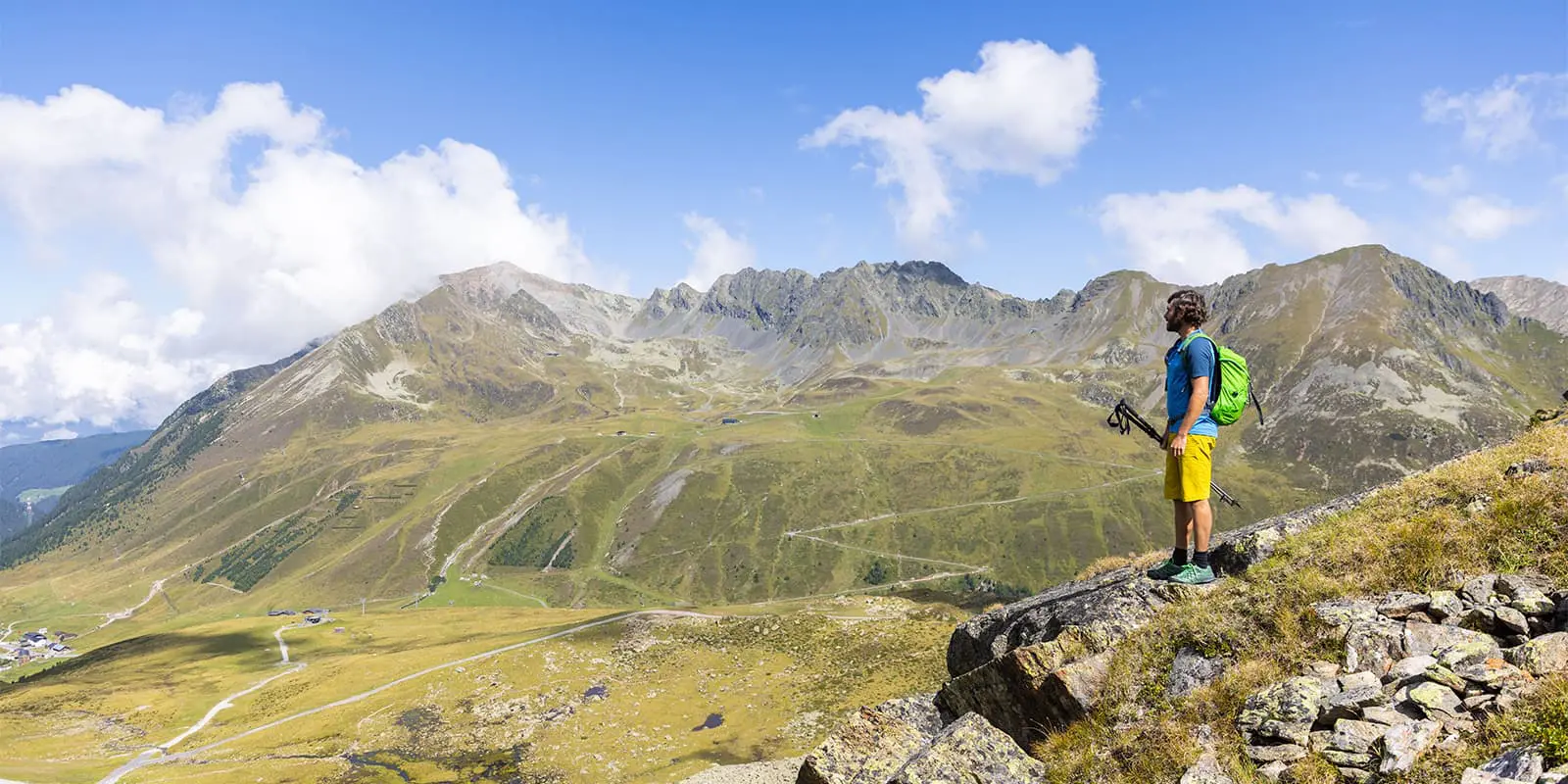 man overlooking the mountains on the Three lakes circuit Kühtai in Tyrol