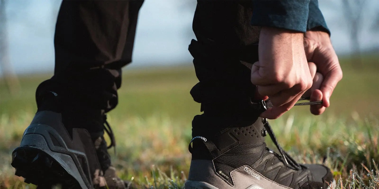 person adjusting his Maier Sports Nil outdoor pants