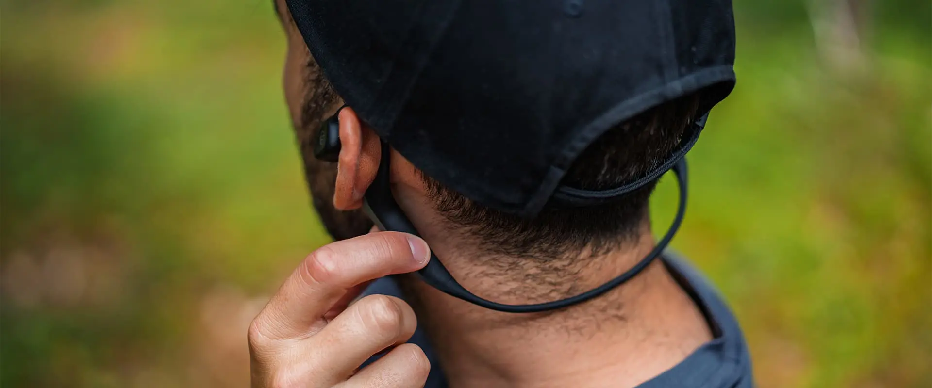 person adjusting his Audio-Technica ATH-CC500BT2 headphone