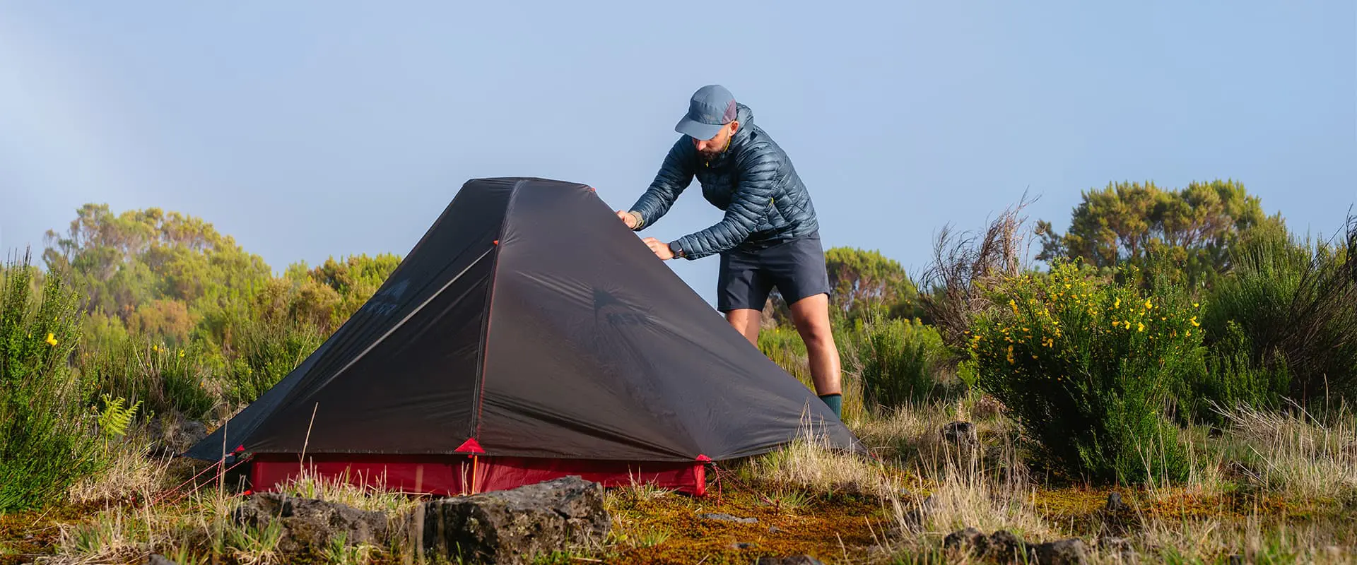 person opening up MSR Hubba Hubba tent