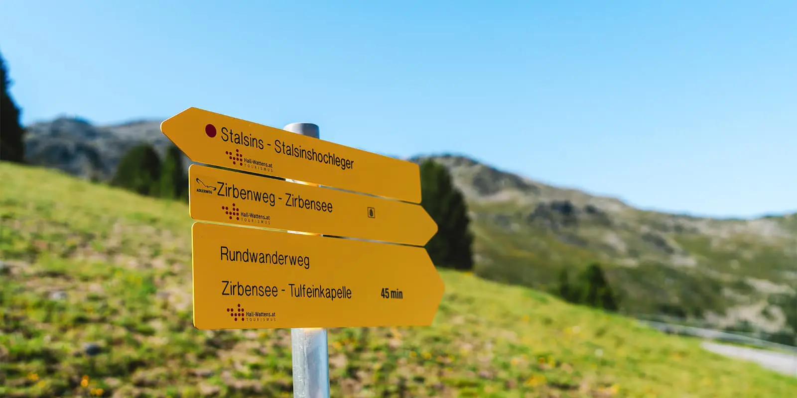 trail sign with hiking trails in the mountains above Innsbruck