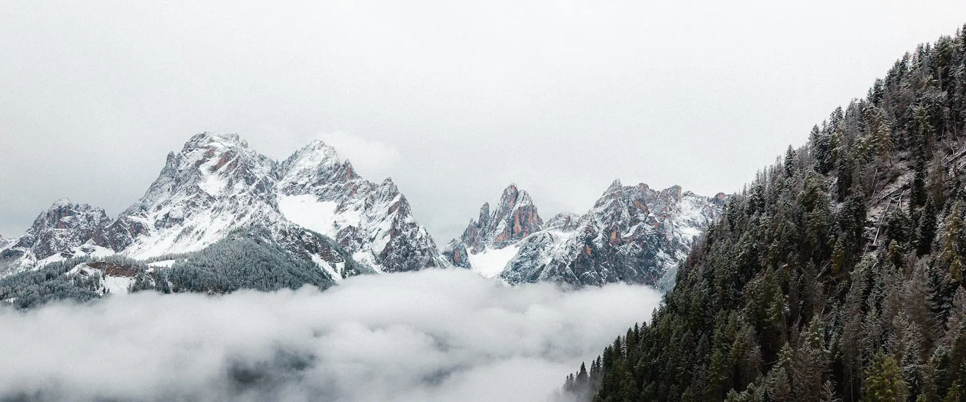 droneshot of snow capped peaks in the Dolomites