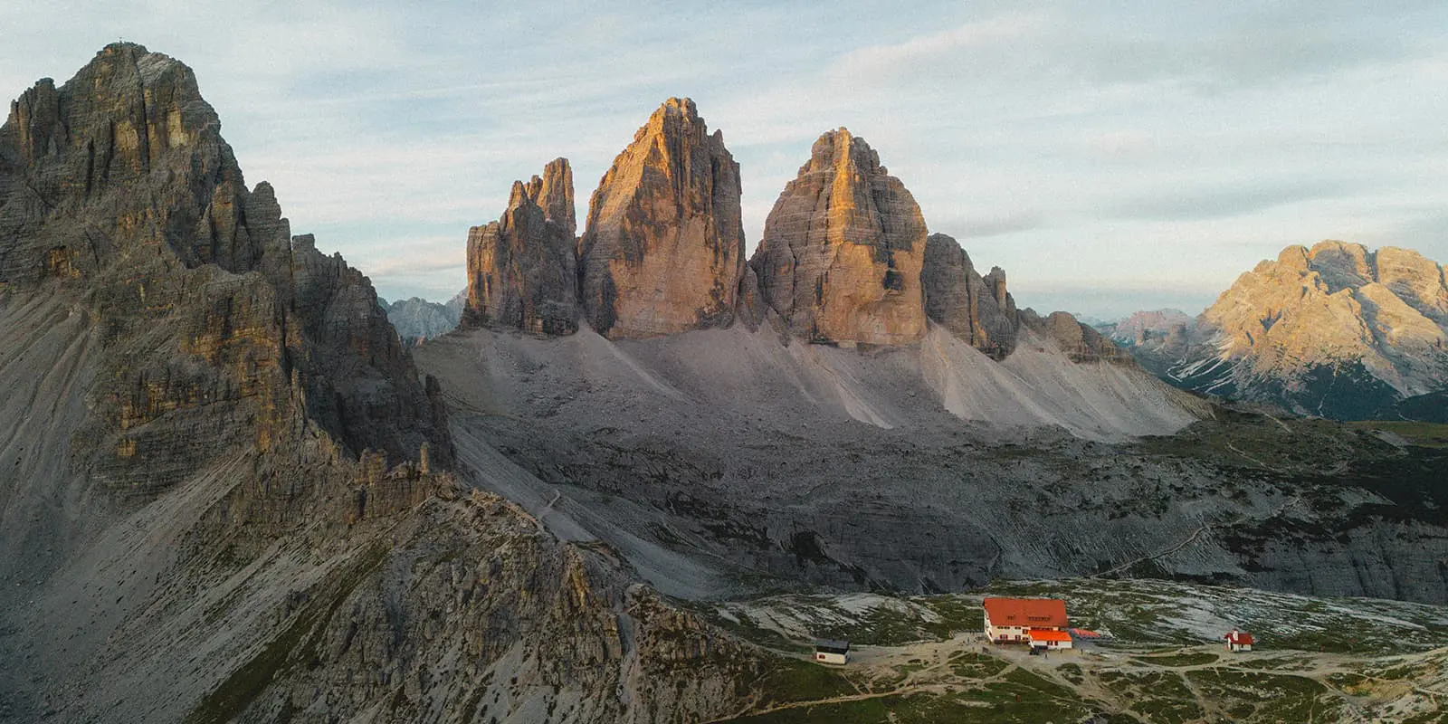 drone shot of the Tre Cime di Lavardo with mountain hut in the foreground