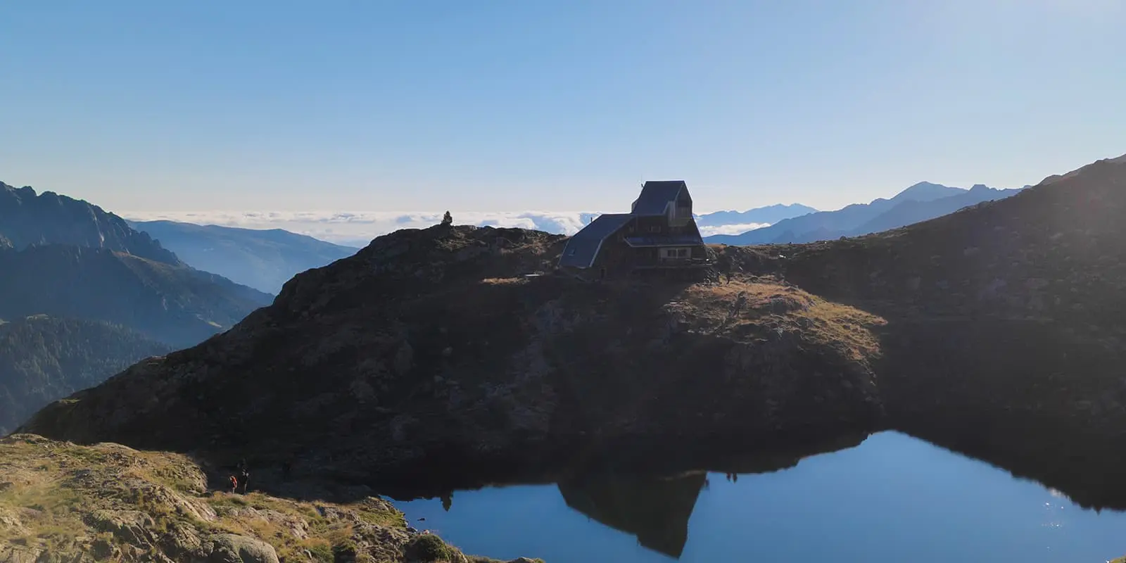 mountain hut near lake on high altitude in the Pyrenees