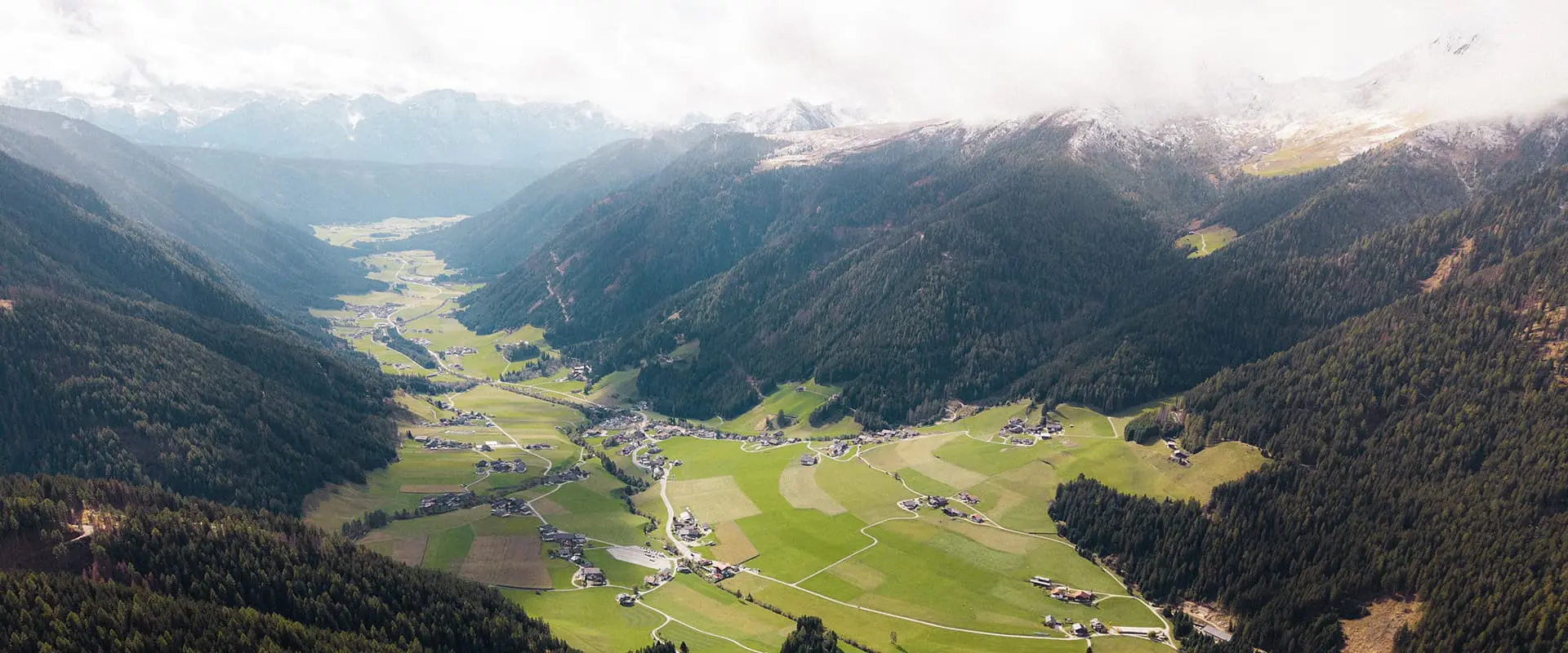 drone shot of Gsiesertal valley in the Dolomites mountains on the Almweg 2000