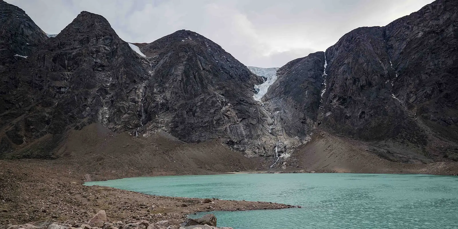 body of water near mountains and glaciers on the Akshayuk pass