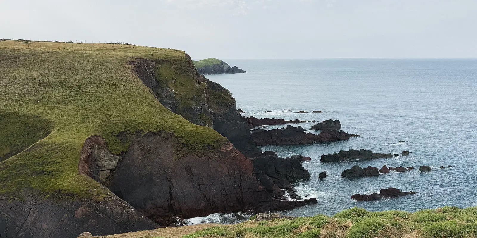 green hills near the ocean on the Pembrokeshire Coast Path