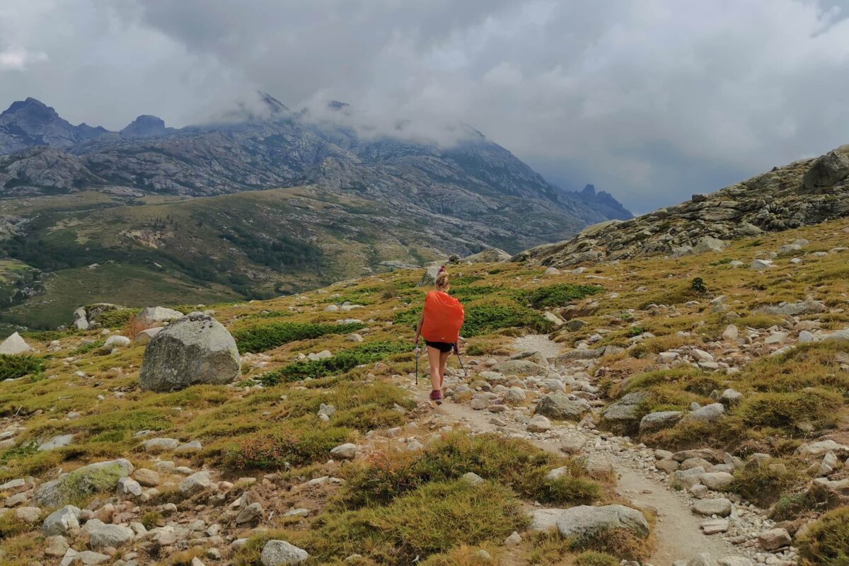 Women hiking on mountain trail on the GR20 in Corsica
