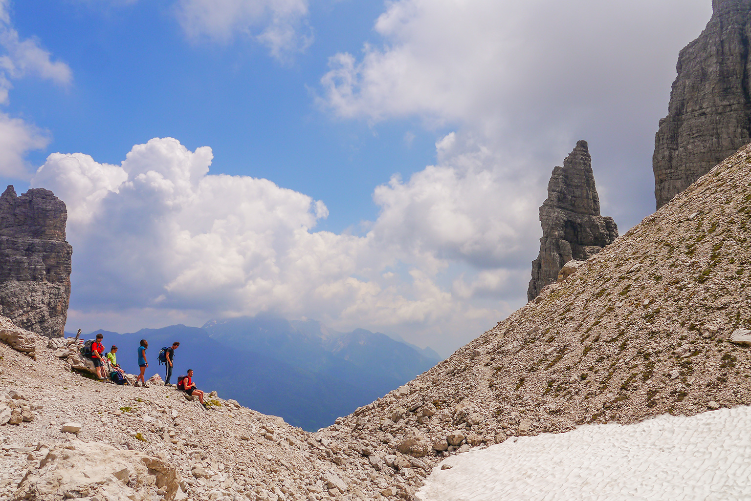 Group of hikers resting from mountain climb in the Dolomites Italy