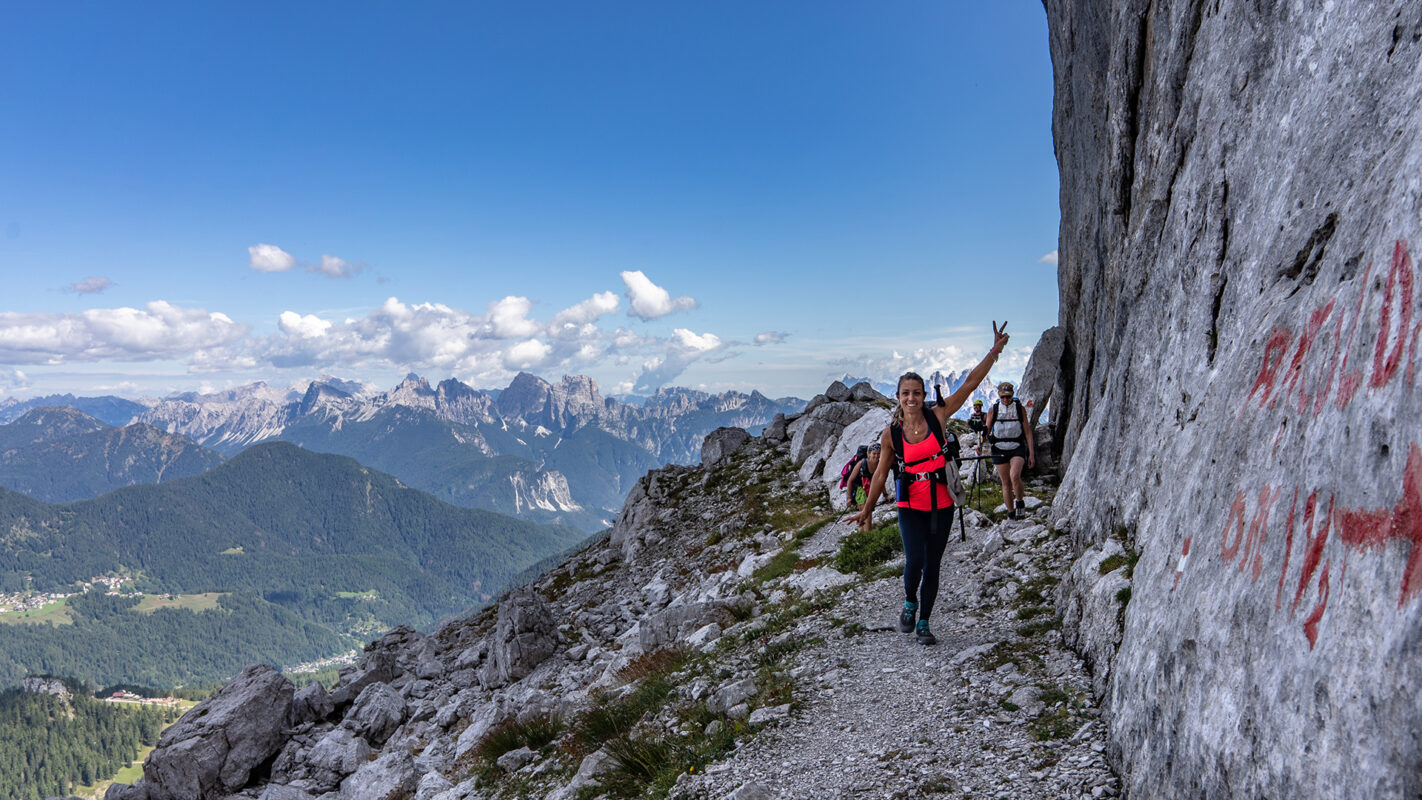 Happy women hiking on mountain path