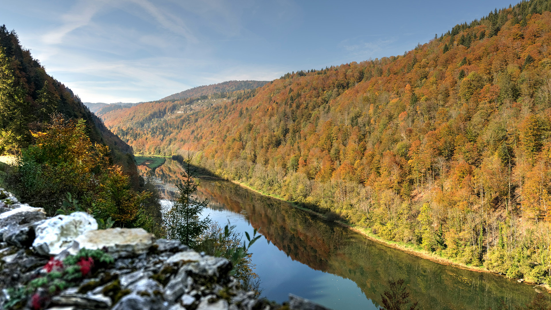 View of the river Doubs, Switzerland in autumn, near Le Noirmont